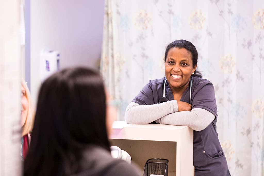 Medical professionals smile and talk